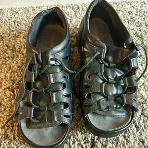 Woman’s black leather Propet sandals. Size 9.